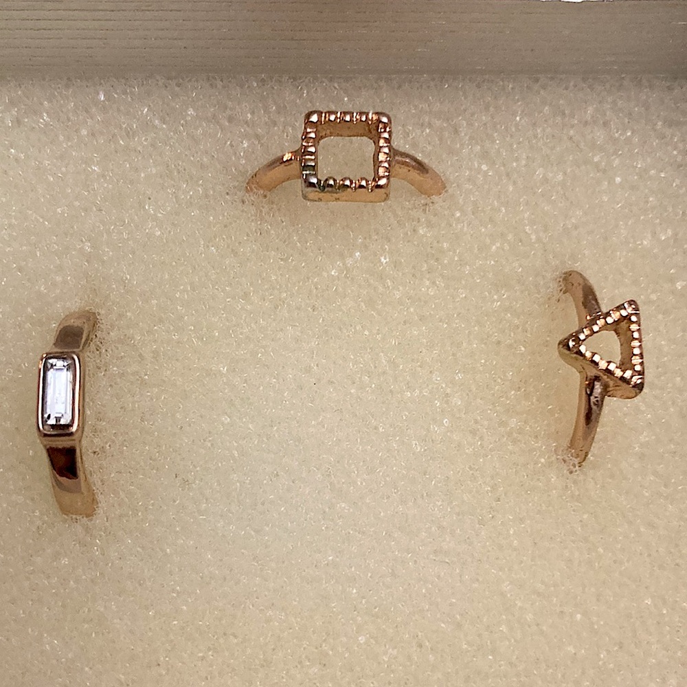 Three matching pinky rings